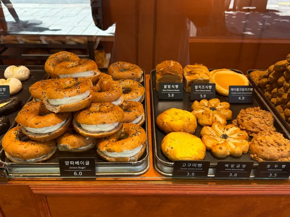 Display case with various types of bread inside Munhwa Bakery