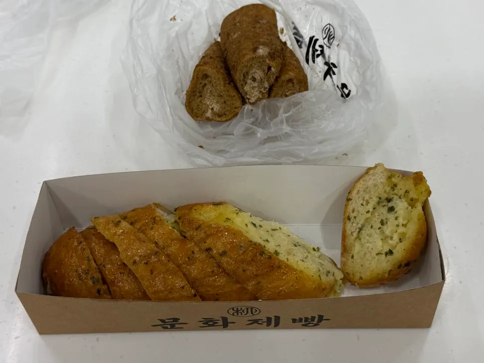Coffee bread and garlic baguette packed together to take home