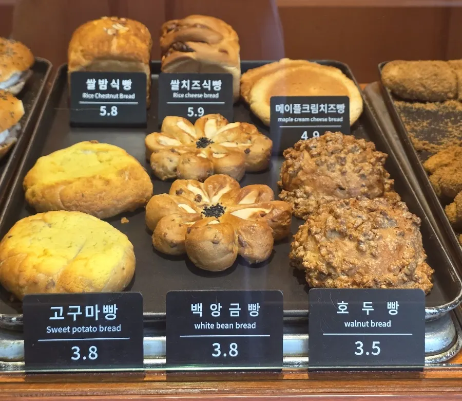 Various breads on Munhwa Bakery's display shelf