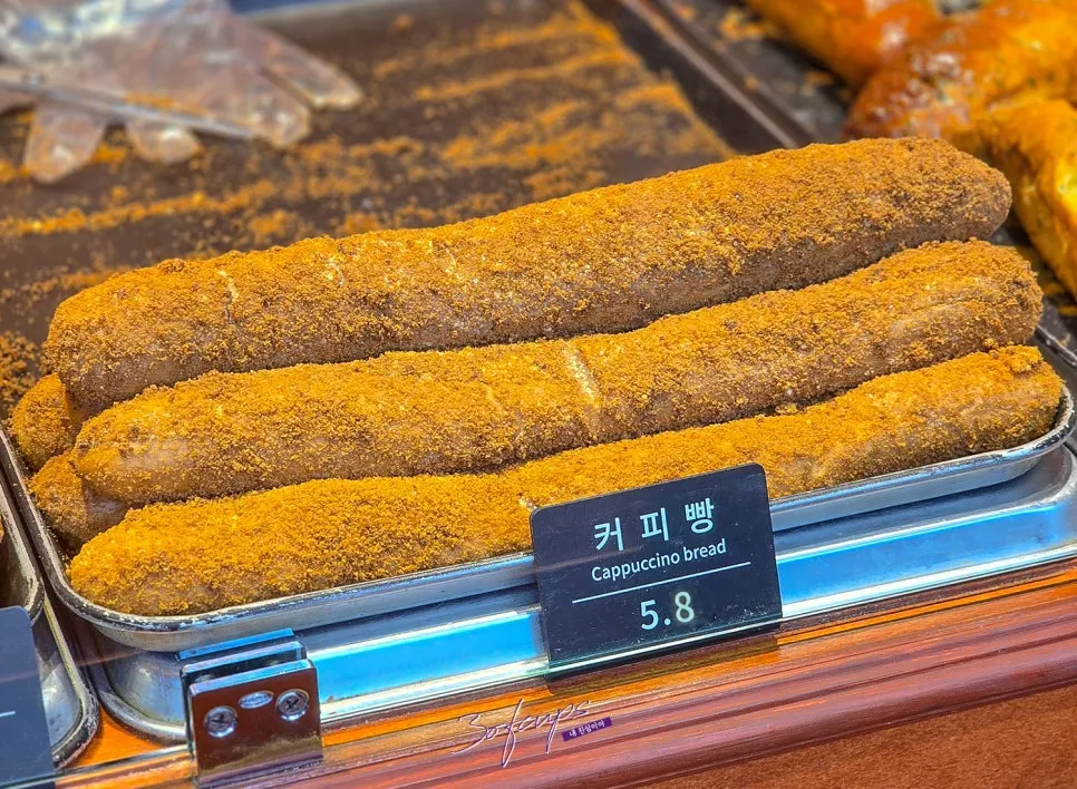 Forearm-sized coffee bread on display
