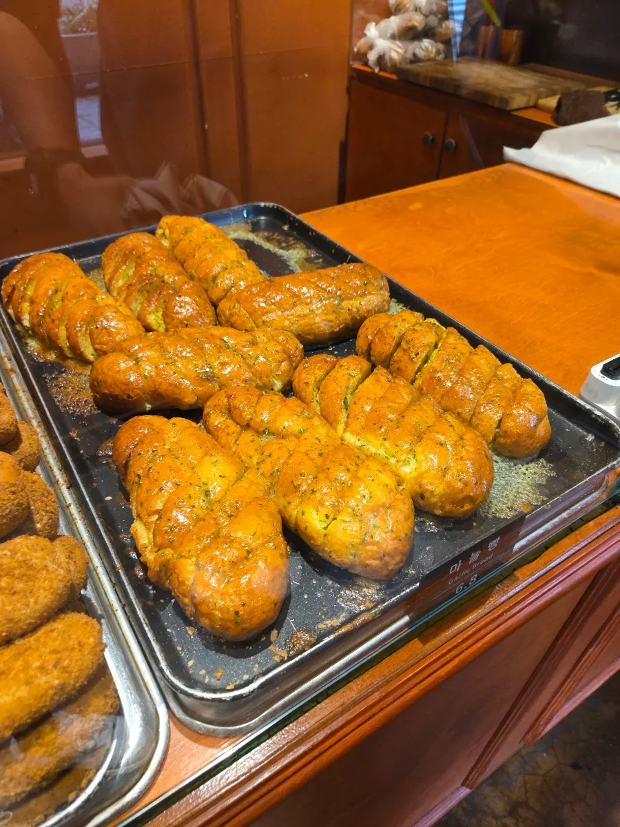 Glossy signature garlic bread at Munhwa Bakery