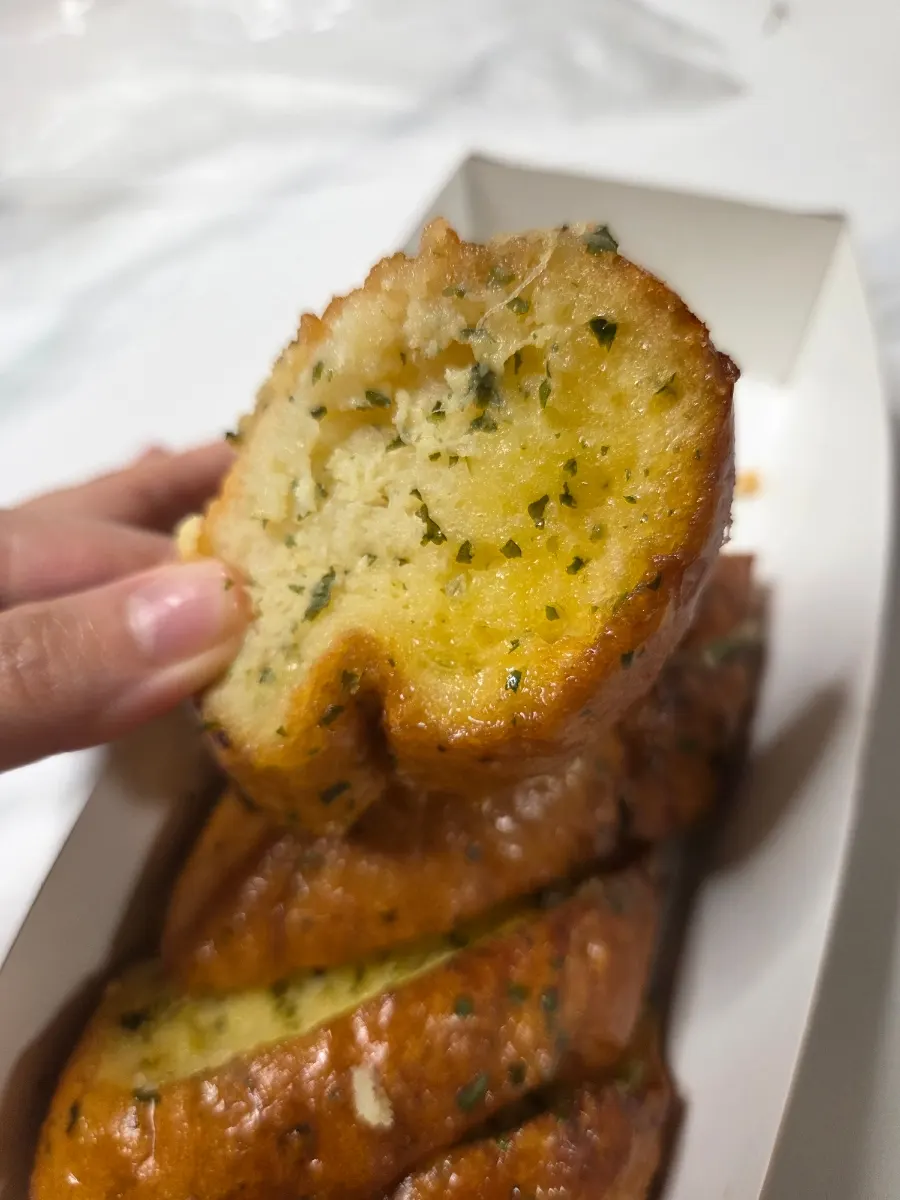 Eating Munhwa Bakery garlic bread with milk