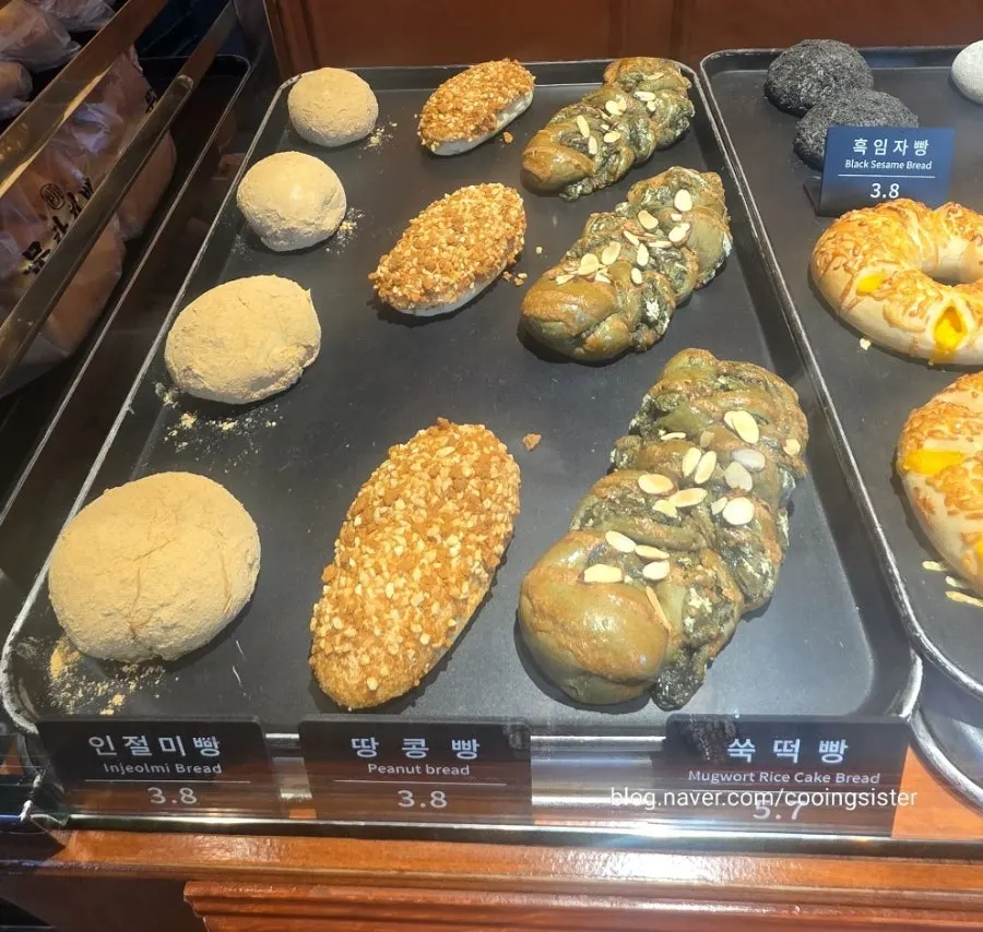 Bread lined up on trays at Munhwa Bakery