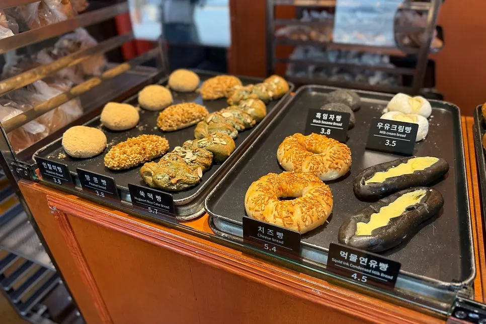 Freshly baked bread displayed on Munhwa Bakery's counter