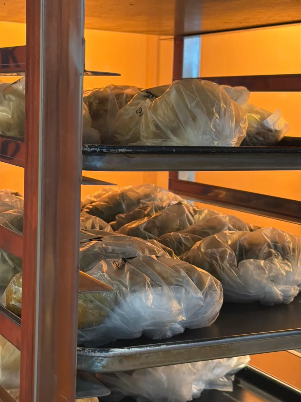 Staff quickly packing orders at the Munhwa Bakery counter
