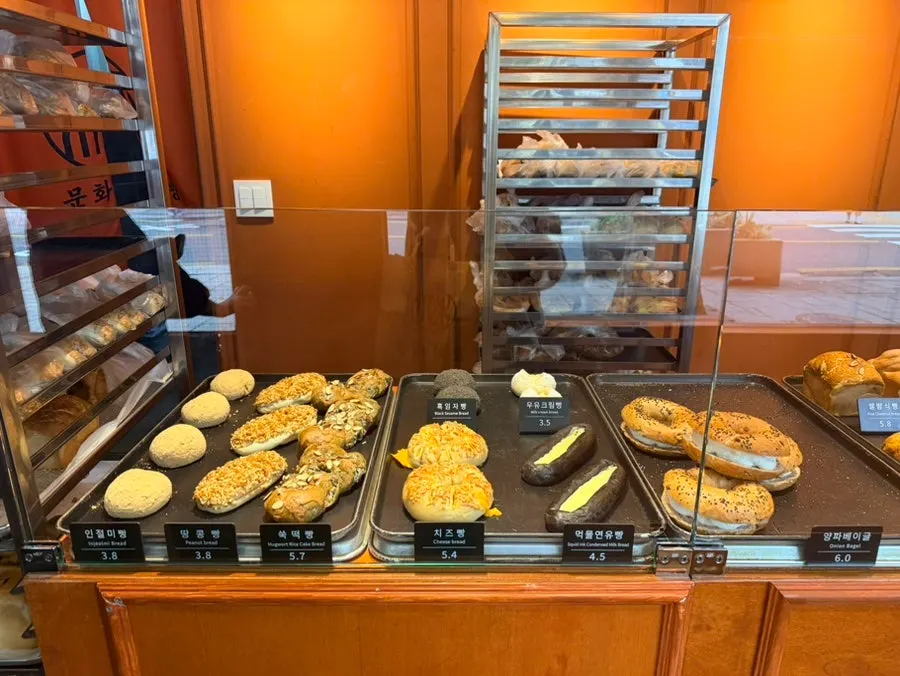 Bread displayed on shelves at Munhwa Bakery