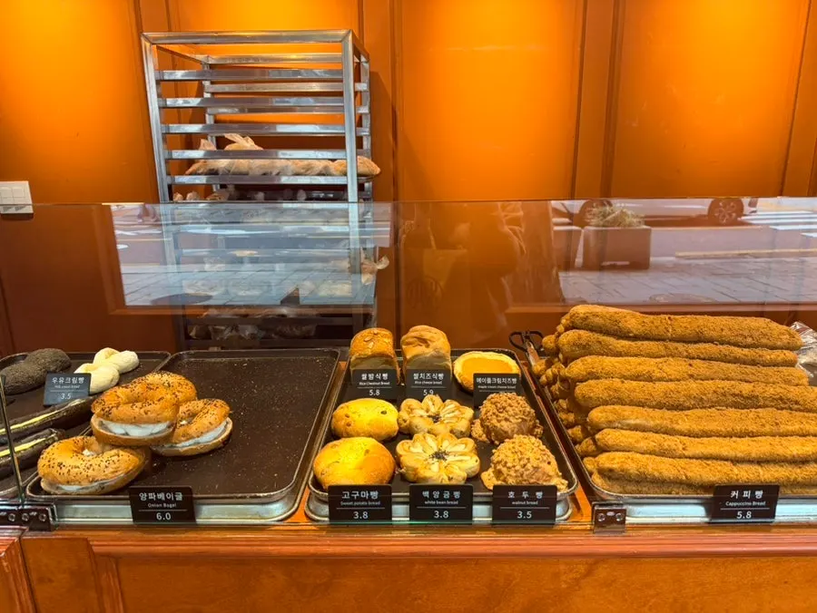 Onion bagel and coffee bread displayed at Munhwa Bakery