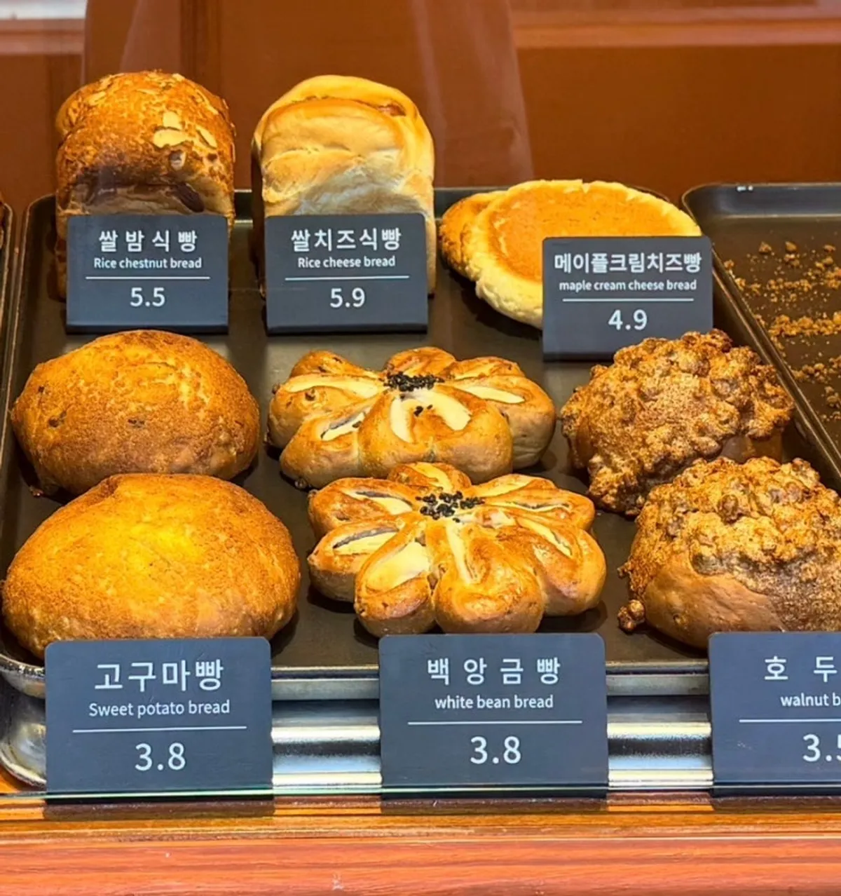 Rice bread loaf and rice cheese loaf displayed at Munhwa Bakery