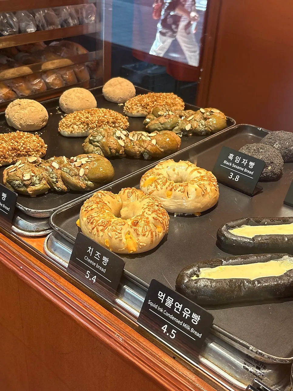 Freshly restocked breads on display at Munhwa Bakery