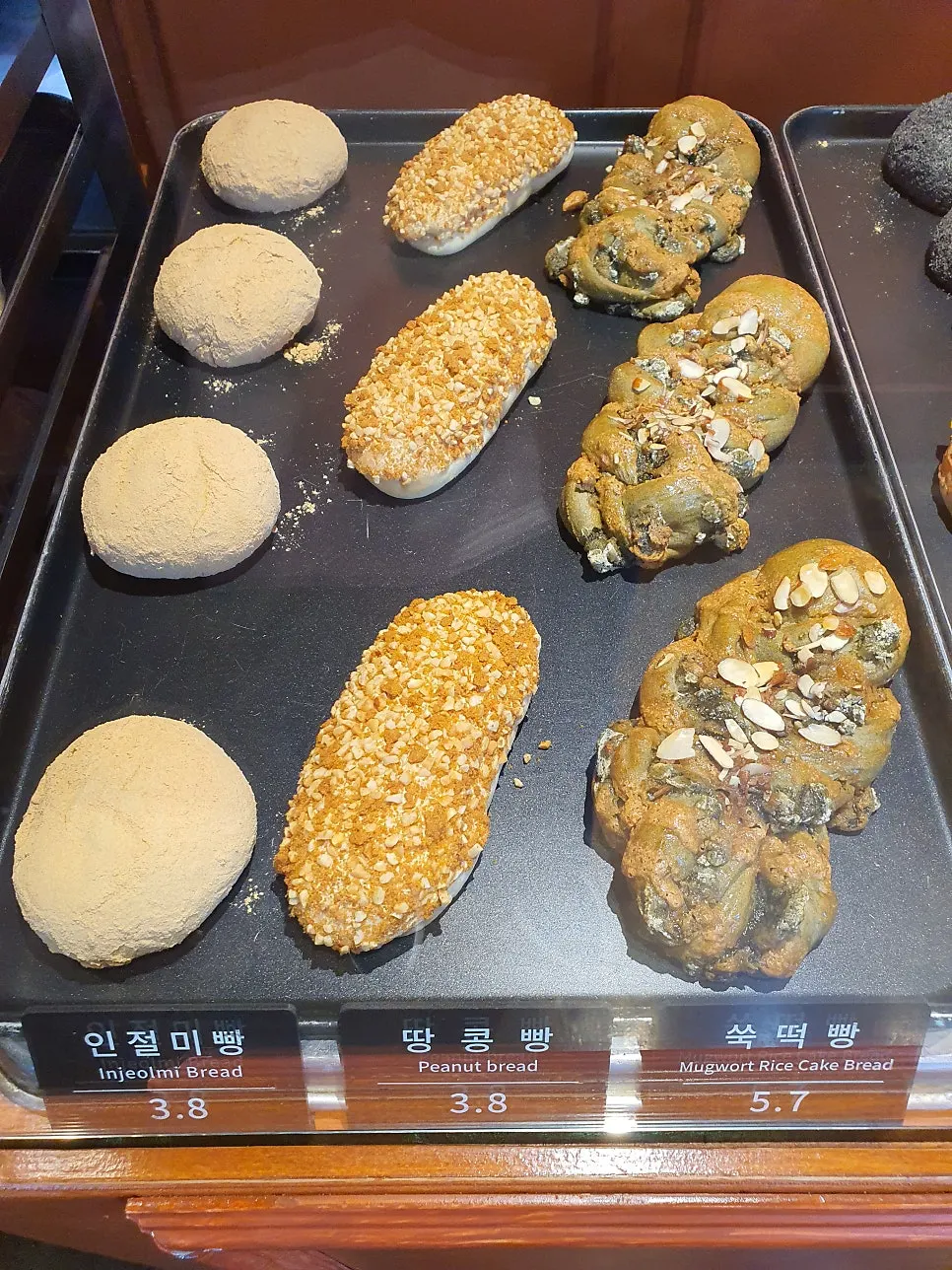 Bread display shelf at Munhwa Bakery with oversized loaves