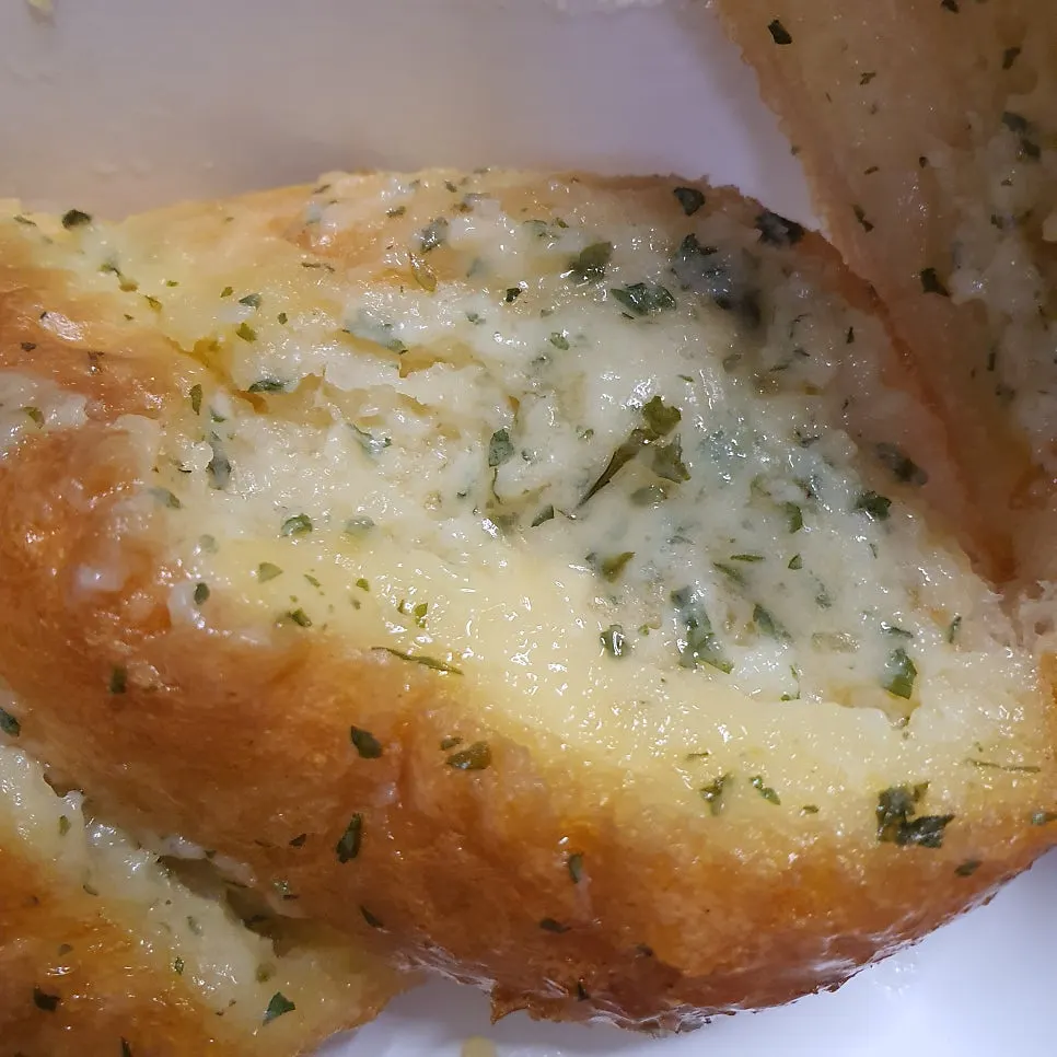 Cross-section of garlic bread, moist all the way through