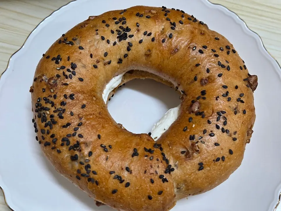 Side-by-side comparison of Munhwa Bakery's onion bagel and garlic bread