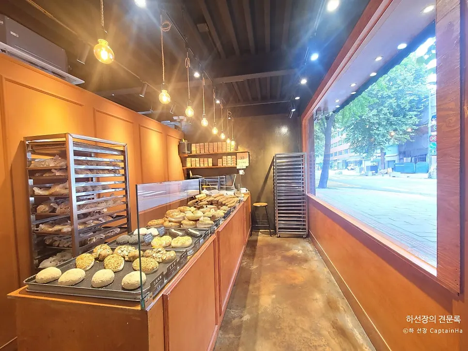 Bread lined up on the display shelves inside Munhwa Bakery