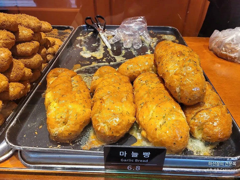 Basket of various breads on display at Munhwa Bakery