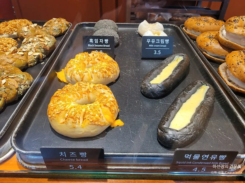 Sweet potato bread and white bean bread on display at Munhwa Bakery