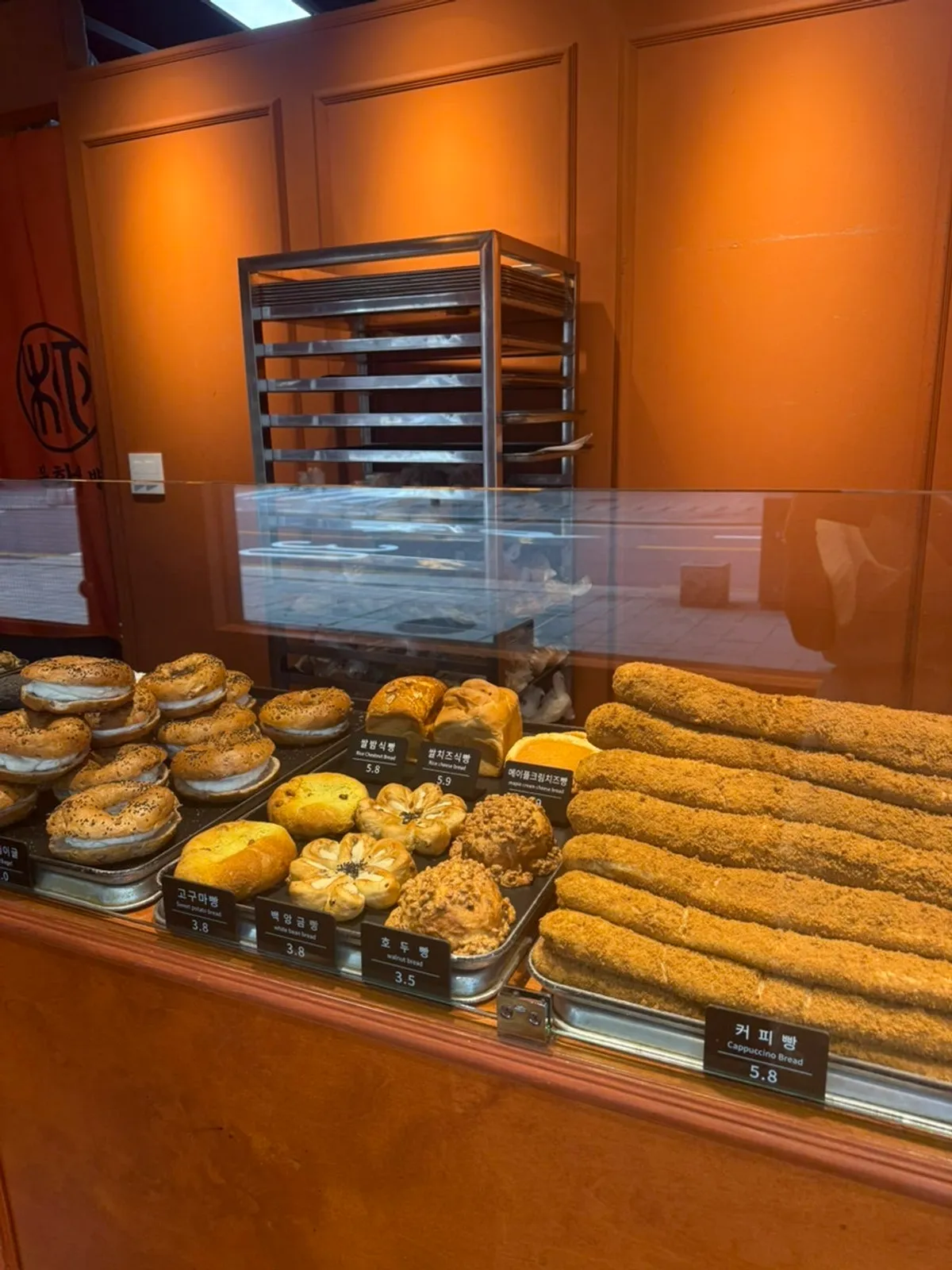 Nutty bread section with injeolmi bread, mugwort rice cake bread, and black sesame bread