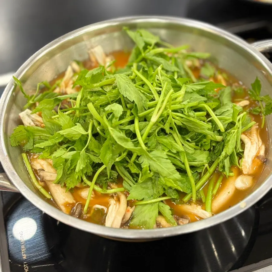 Table setting of shabu kalguksu for two with a 140g sirloin add-on