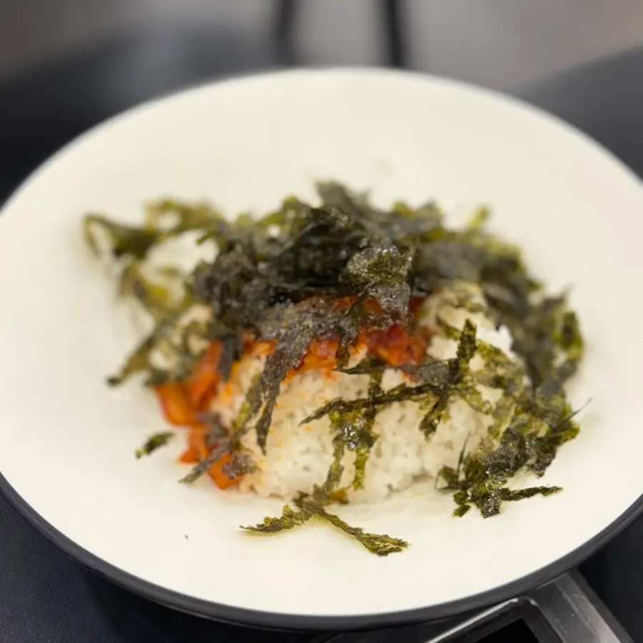 Minari fried rice being cooked in the leftover broth