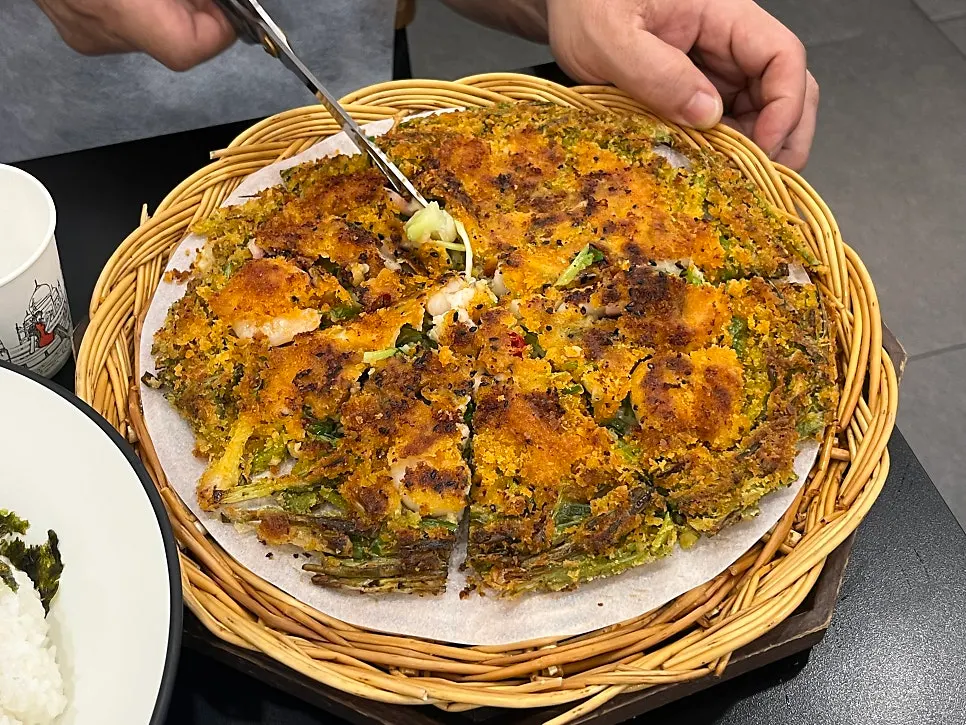 Table spread with crispy seafood pajeon