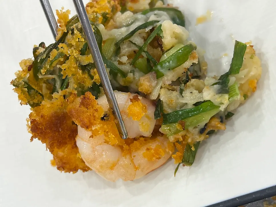Seafood pajeon cut into pieces with scissors