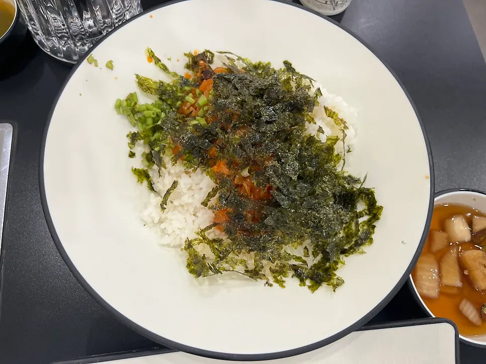 Chewy kalguksu noodles lifted with chopsticks