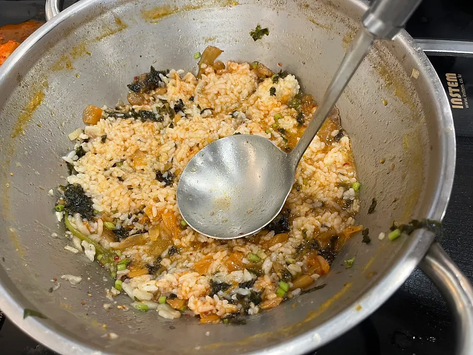 Flat noodles added into the shabu pot