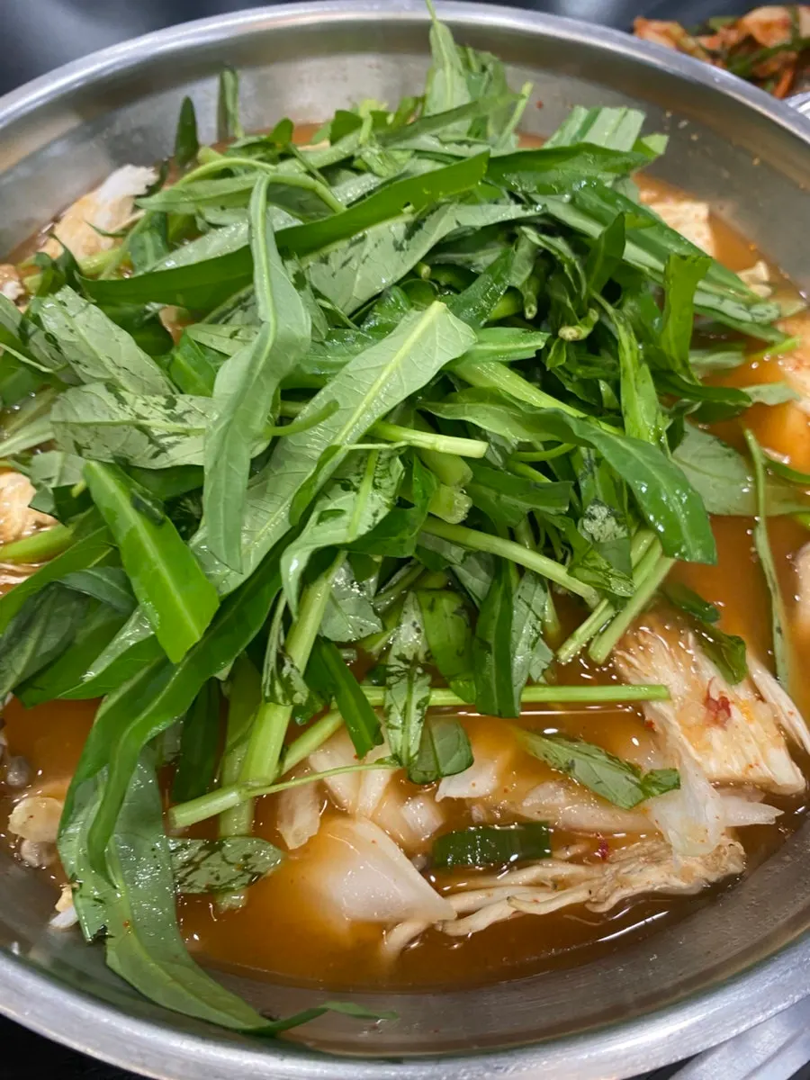 Beef sirloin cooking in the boiling red broth