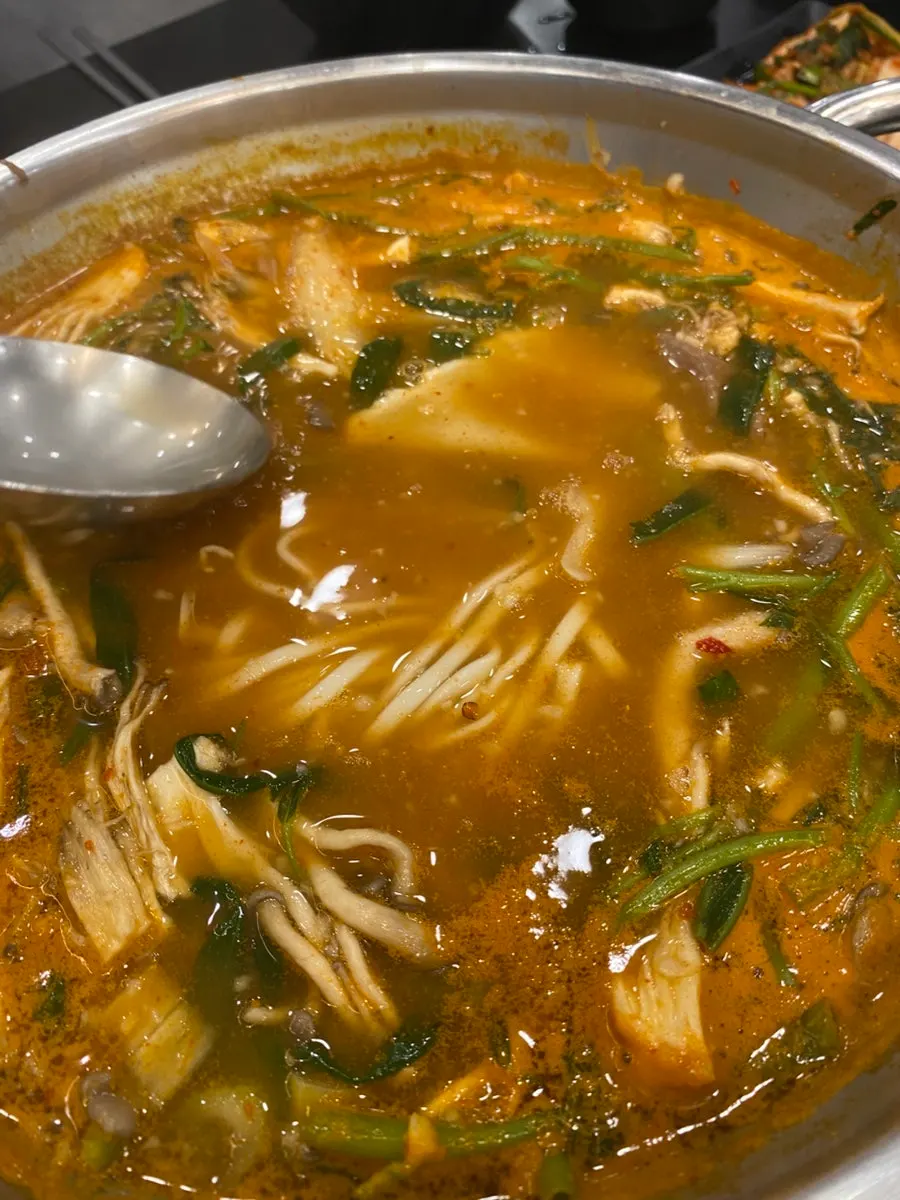 Self-made kalguksu noodles and sujebi added to the broth