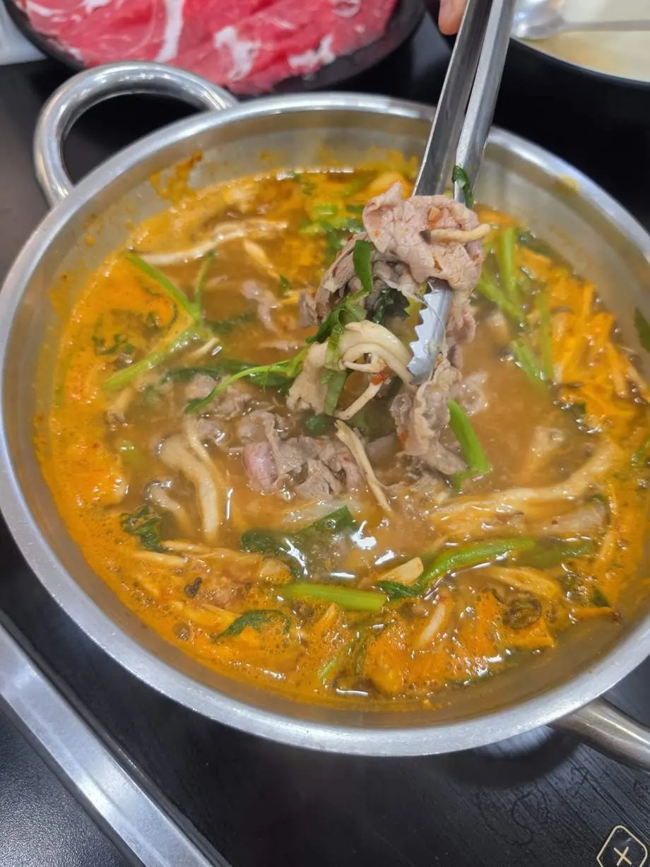 Sirloin lightly cooked in the red shabu broth