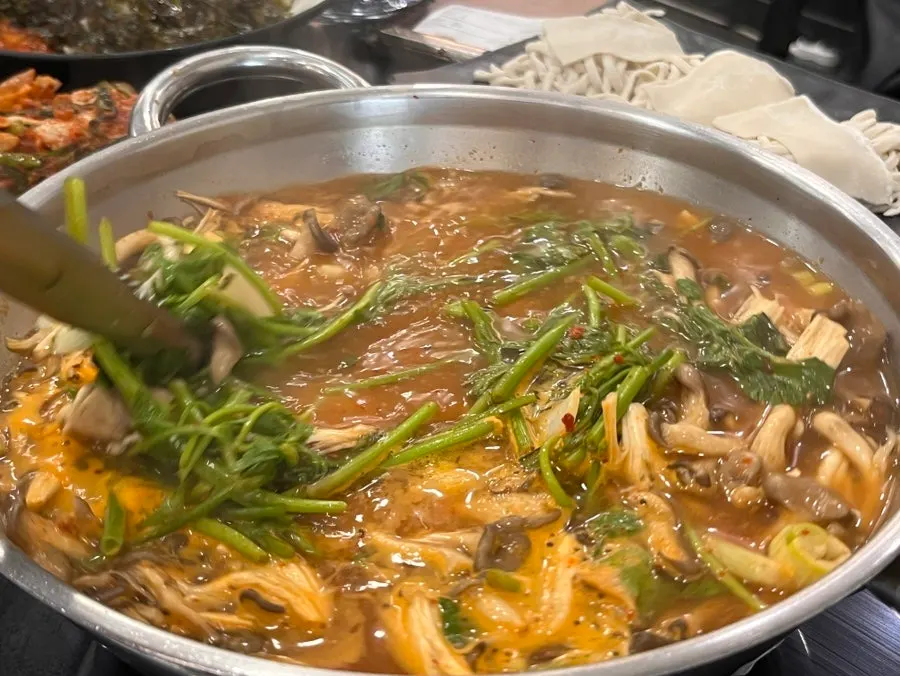 Pot of shabu broth simmering
