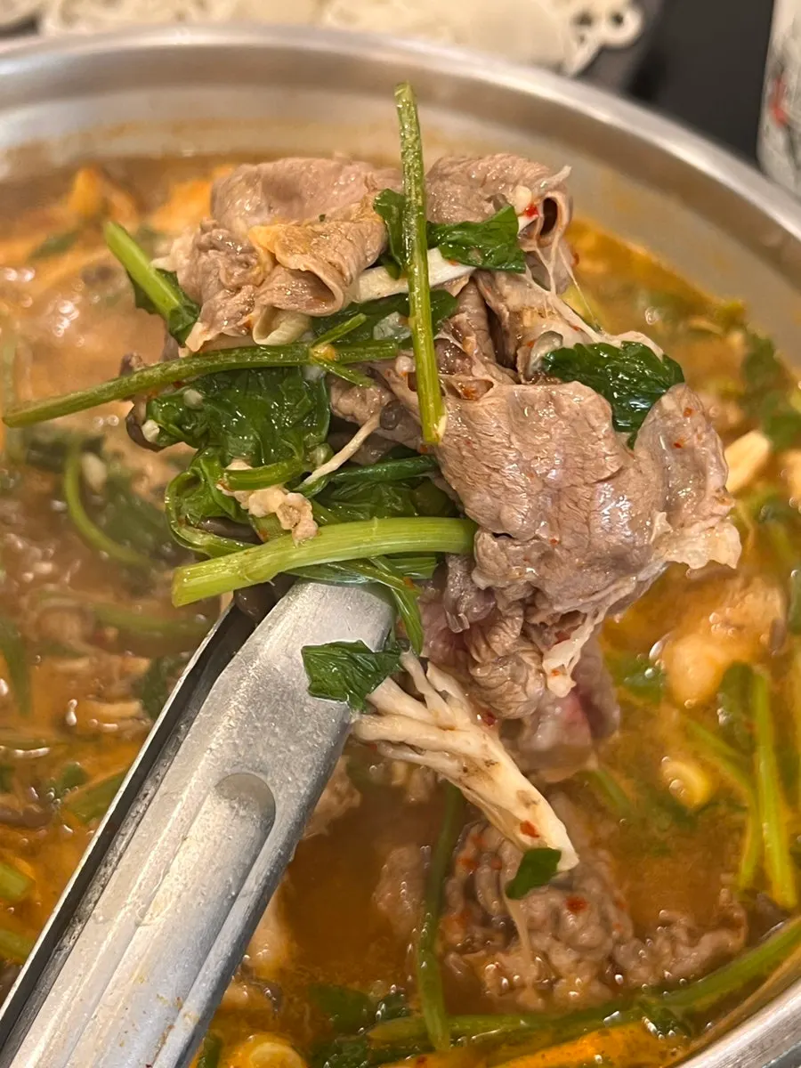 A piece of beef cooked shabu-shabu style