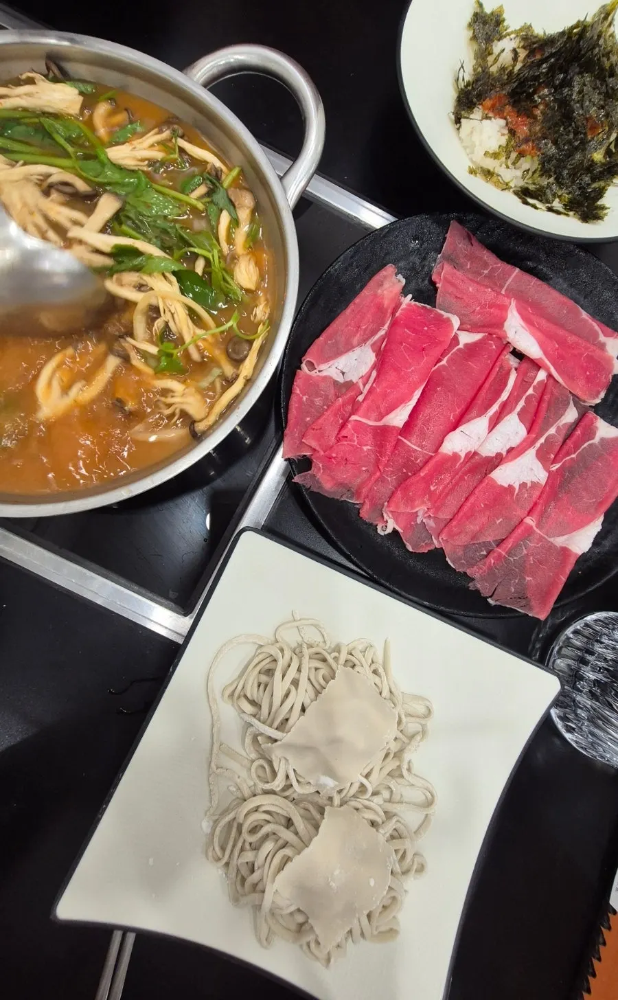 A full shabu-shabu table setup