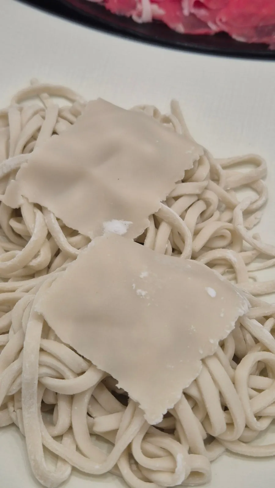 House-made kalguksu noodles topped with sujebi dough bits