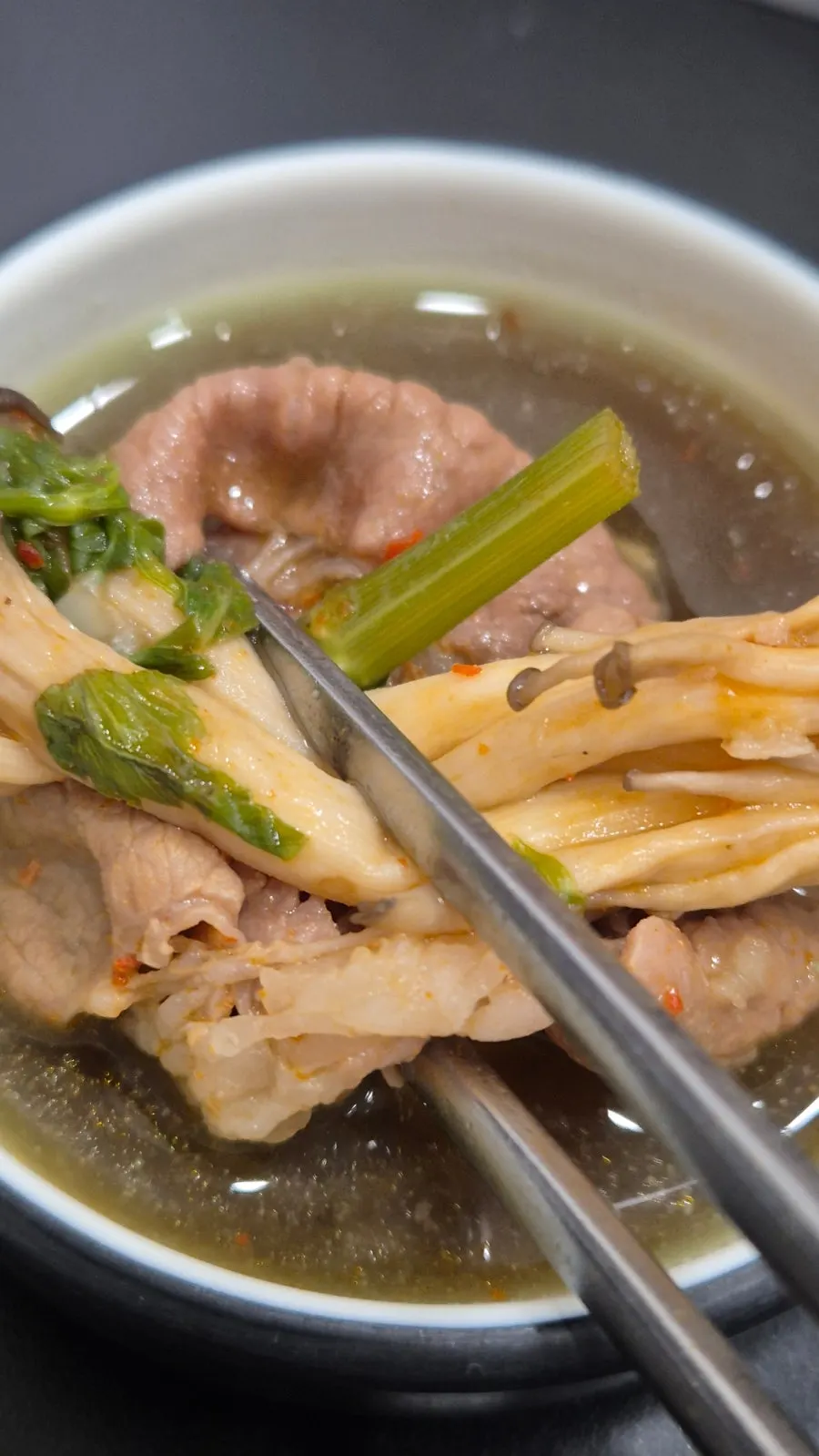 A plate of shabu-shabu meat and vegetables