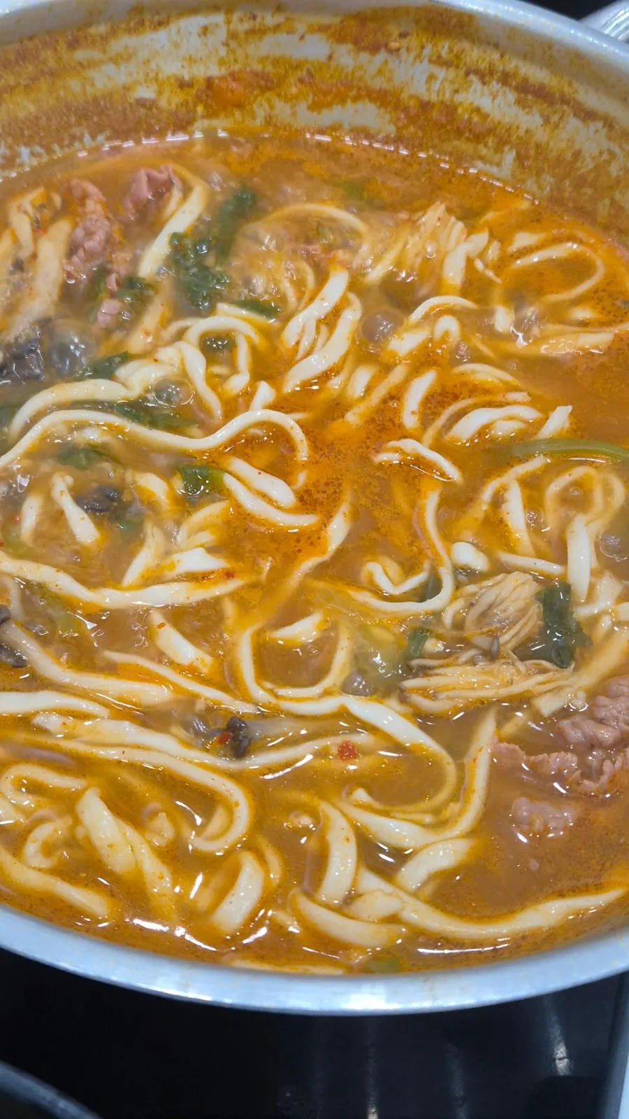 House-made kalguksu noodles added to the broth