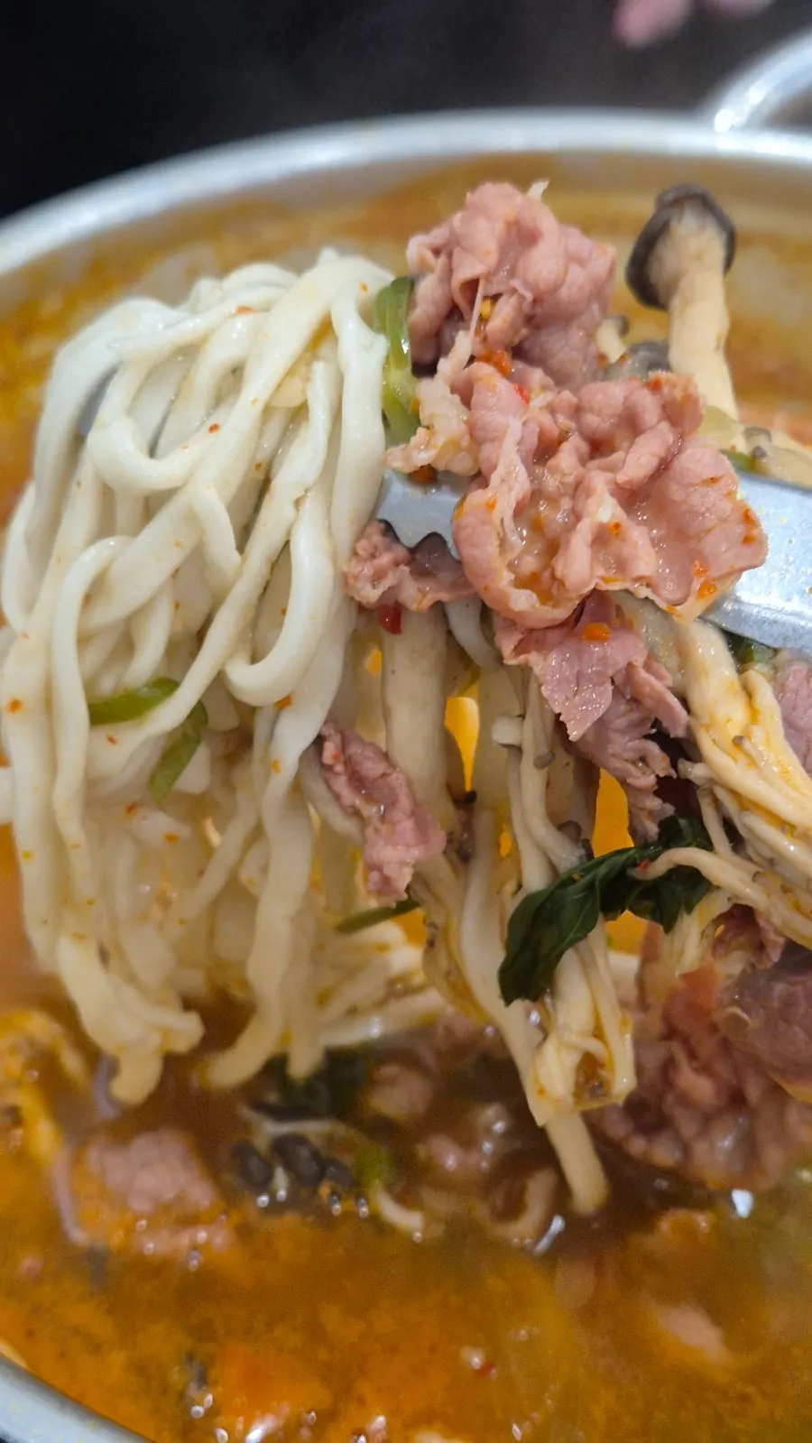 The kalguksu pot bubbling away