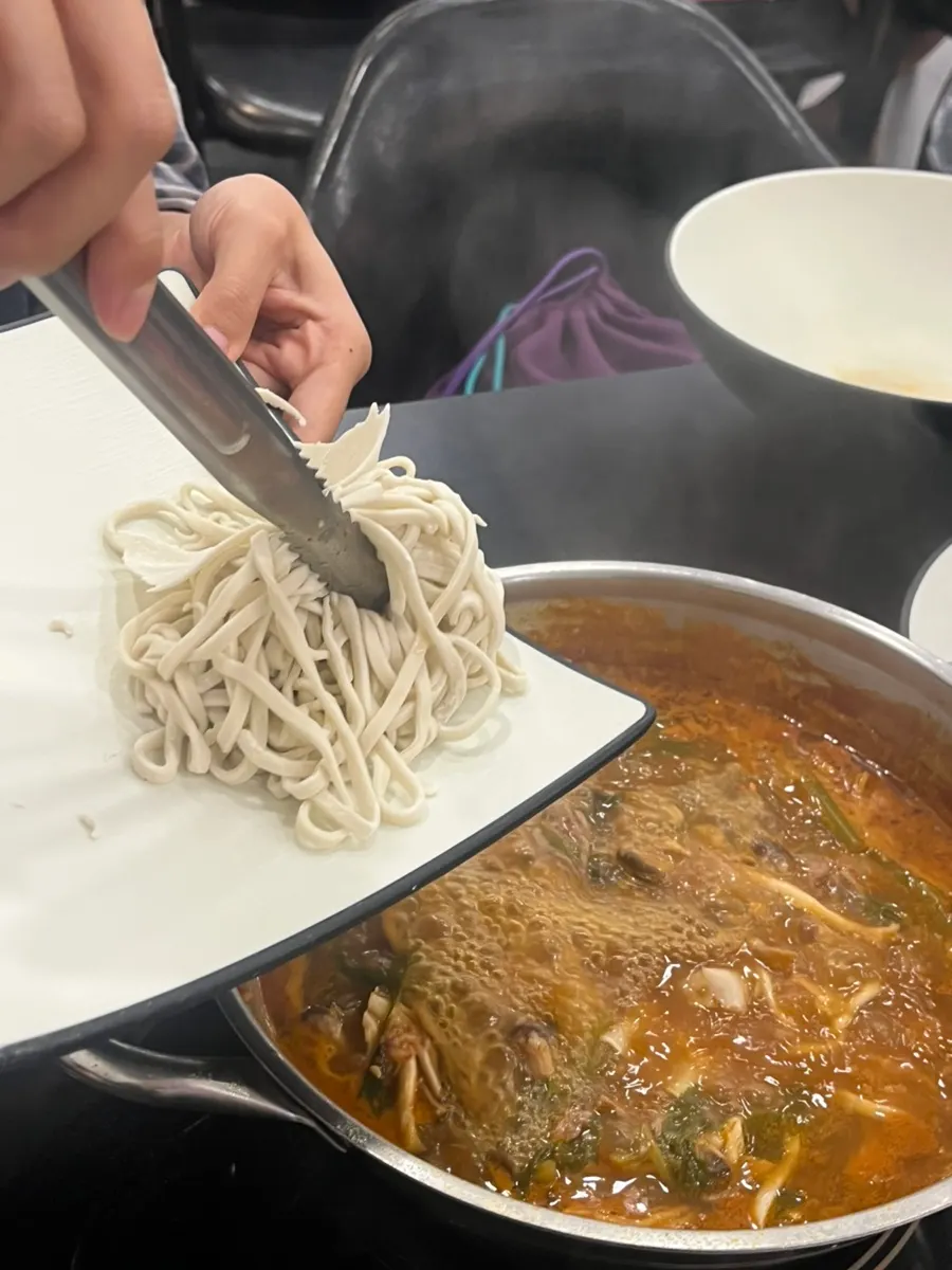 Richly infused broth with shabu-shabu ingredients