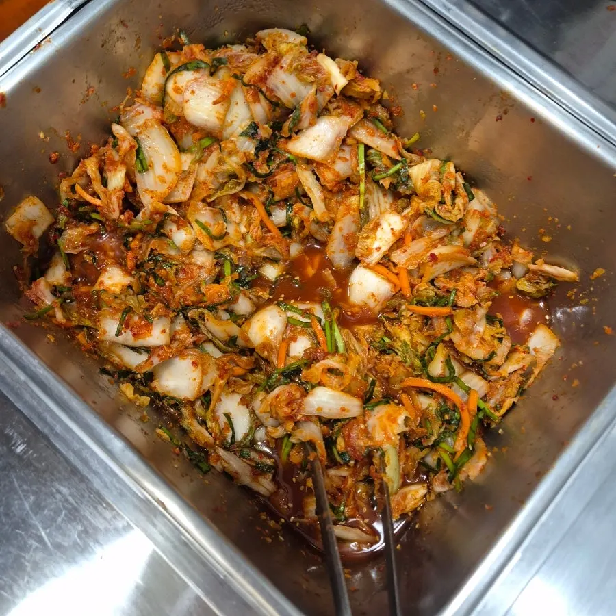 Kalguksu noodles added into the rich broth