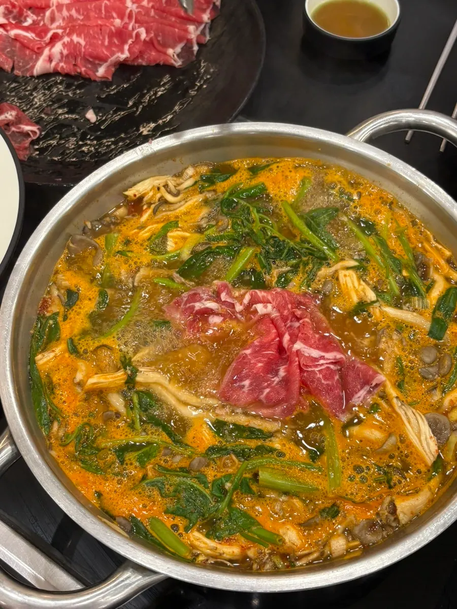 Plates of domestic kimchi and kkakdugi side dishes