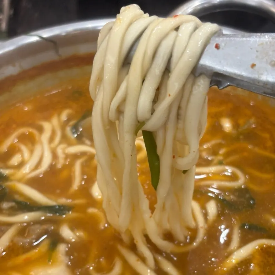 Pot with house-made kalguksu noodles added
