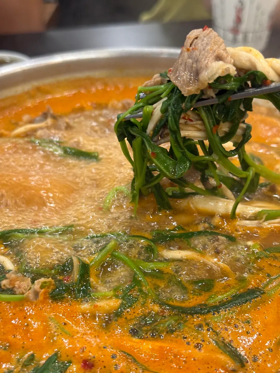 Menu board listing the ₩11,000 shabu kalguksu