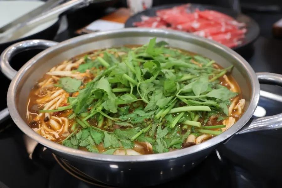 Shabu ingredients prepared with vegetables, mushrooms, and sirloin