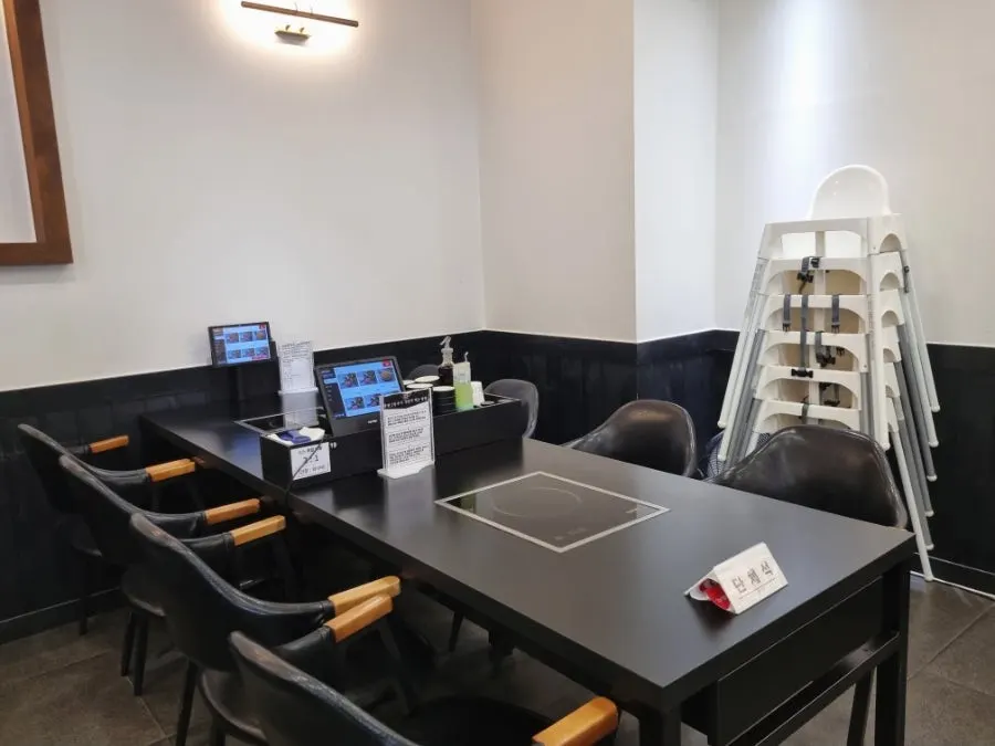 Interior of the restaurant with a baby chair set up