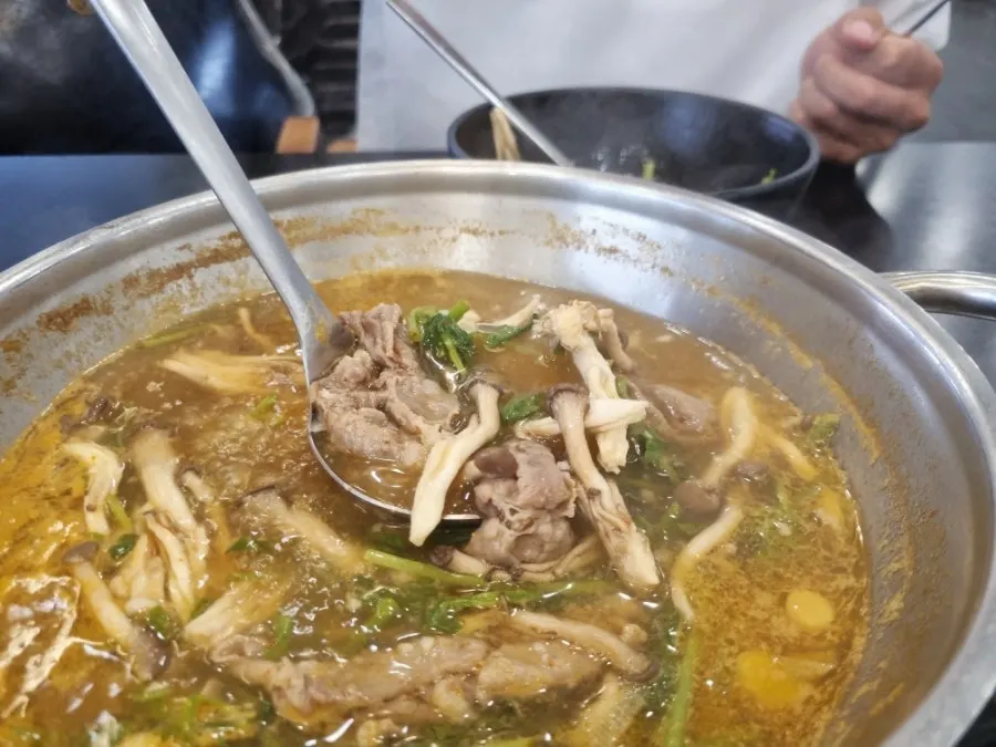 Pot of shabu kalguksu at a boil