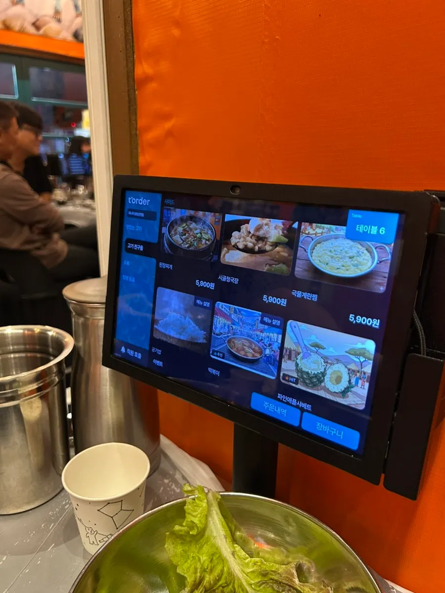 Menu board with meat items and prices