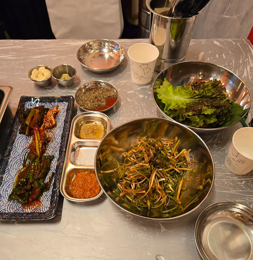 Table filled with naengsam and basic side dishes
