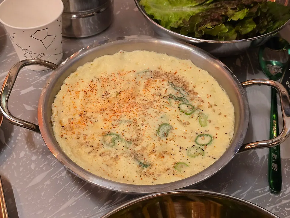 Minari and kimchi placed together on the griddle