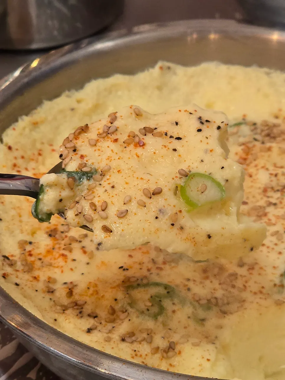Egg soup piled high in a galvanized-steel-style pot