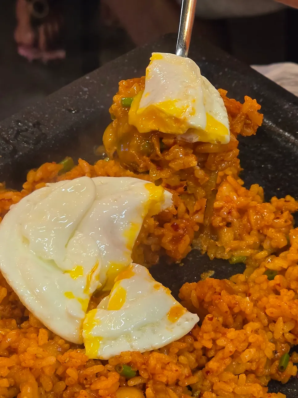 Minari fried rice topped with a fried egg