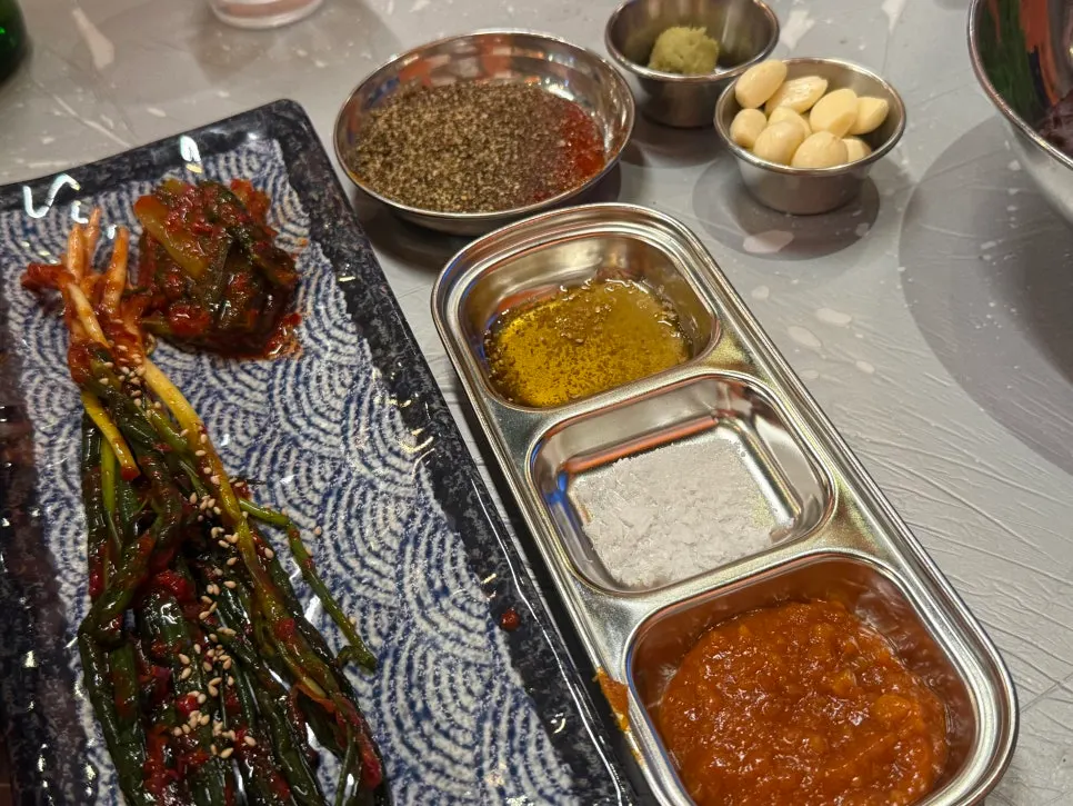 Side dishes and a plate of minari set on the table